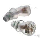 Two small, transparent in-ear hearing aids with flexible, tapered tips and pull tabs, shown against a white background.